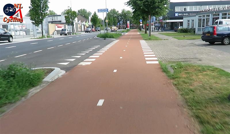 A commercial driveway crossing. There is virually no difference between this and a side street crossing.